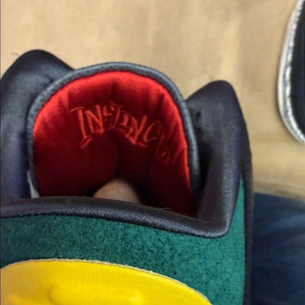Jordan Low-Top Sneakers in Black with Red, Yellow, and Green Accents
